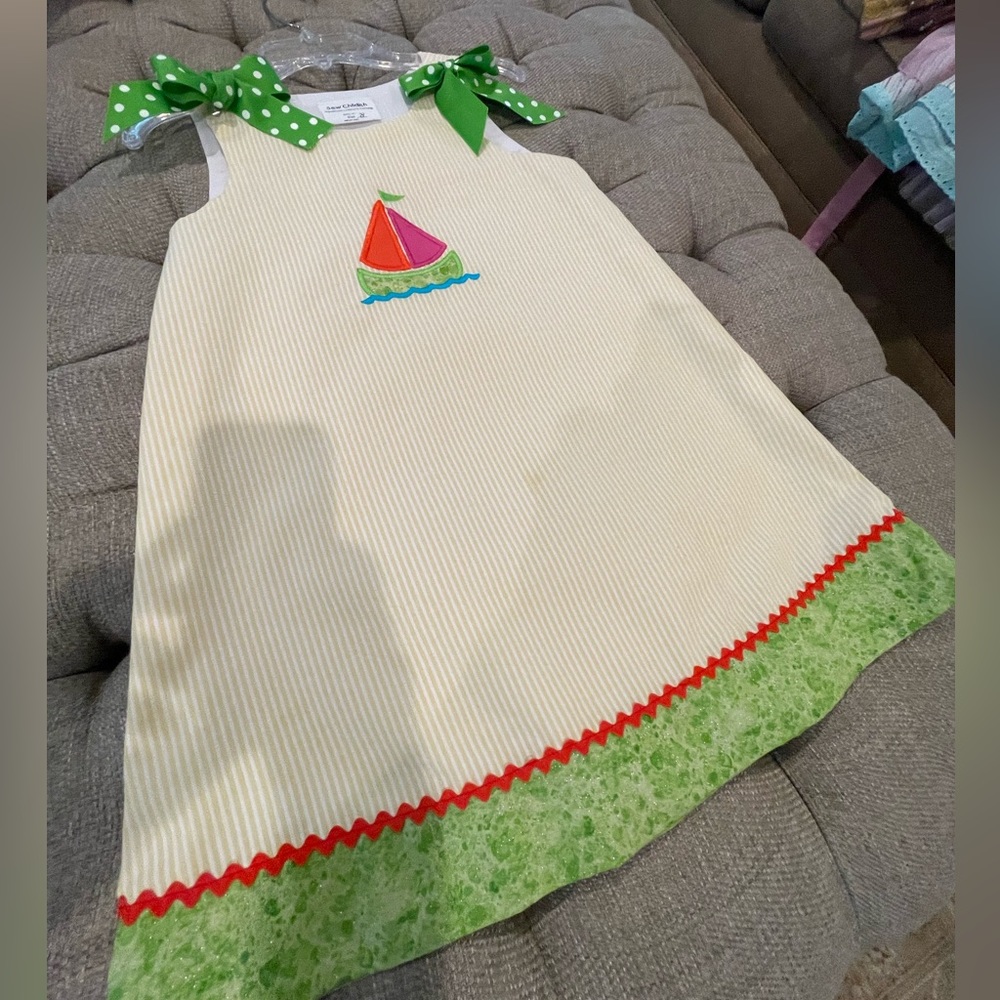 Handmade Child’s sailboat dress.  Yellow size 8.  Green polka dot bows. Easter